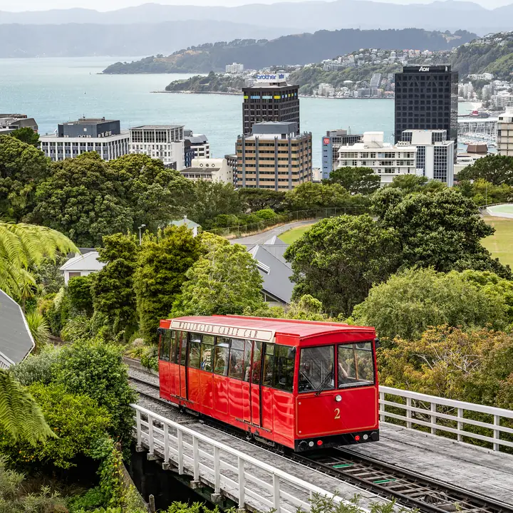 The finished puzzle: a red Cable Car climbing to Kelburn, with Wellington's city towers and the harbour beyond